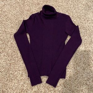 Like new purple turtleneck. Size medium but would say it fits like a small.